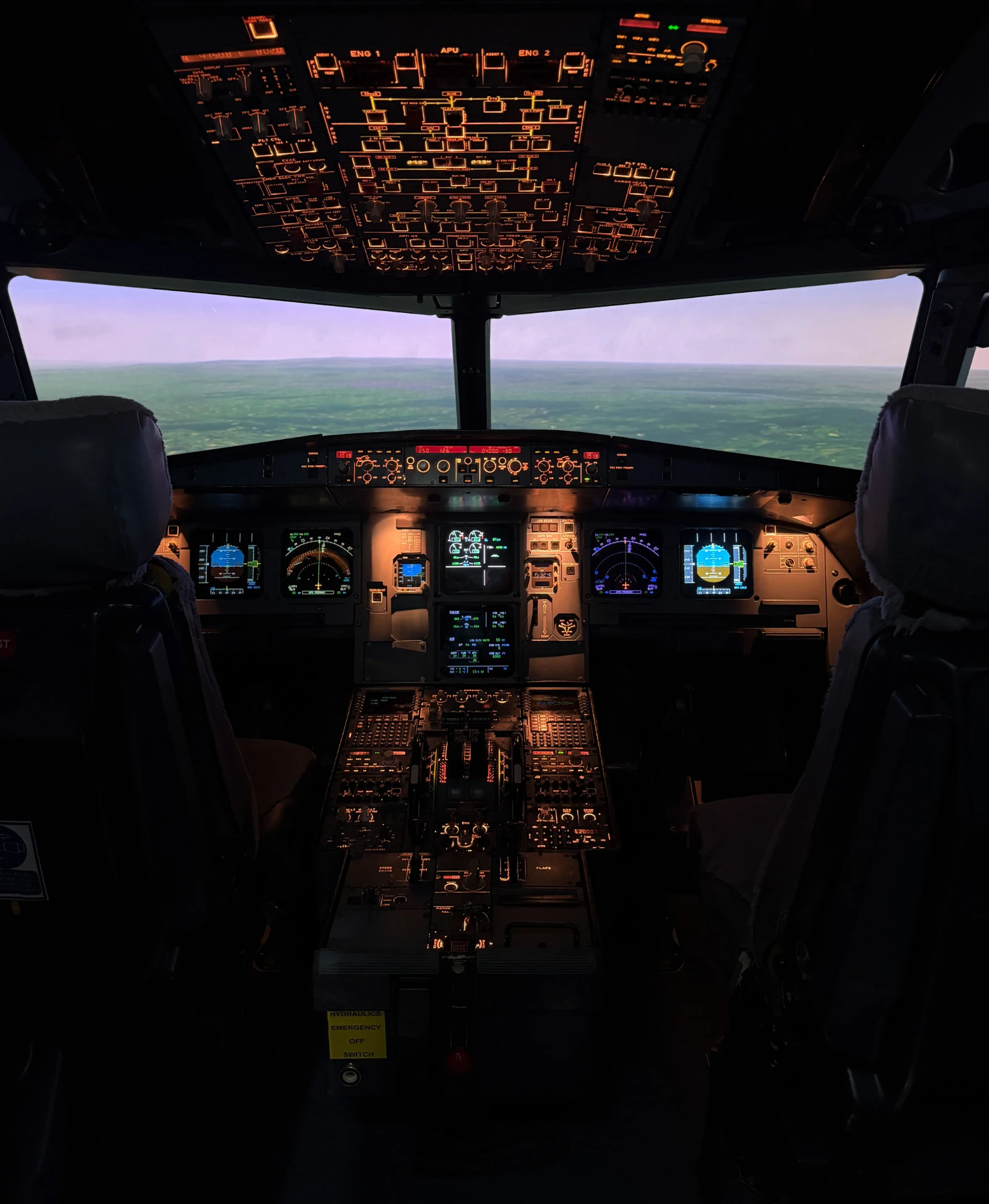 Airbus A320 cockpit at dusk with illuminated panels
